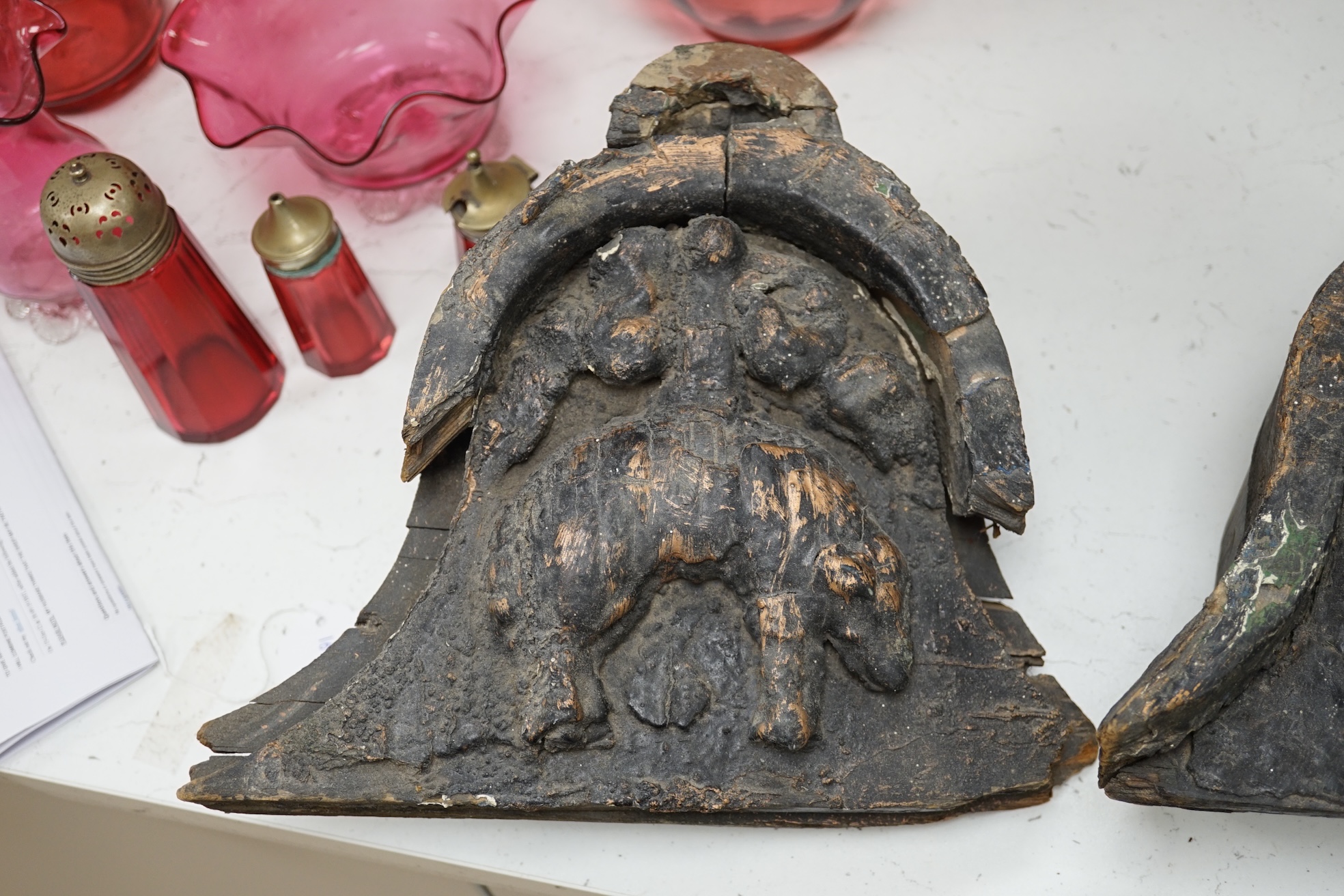 Two 17th/18th century ‘Golden Fleece architectural pine signs with partially gilt decoration, by repute the Golden fleece device was used on a hardware store in Horninglow Street, Burton on Trent 27cm high. Condition - f